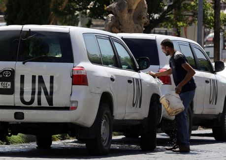 1.Đoàn xe phái đoàn LHQ tới thủ đô Damascus ngày 25-9-2013. Ảnh AFP TTXVN